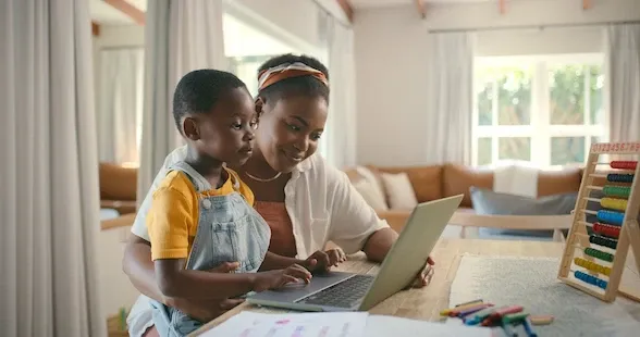 mother and child using laptop